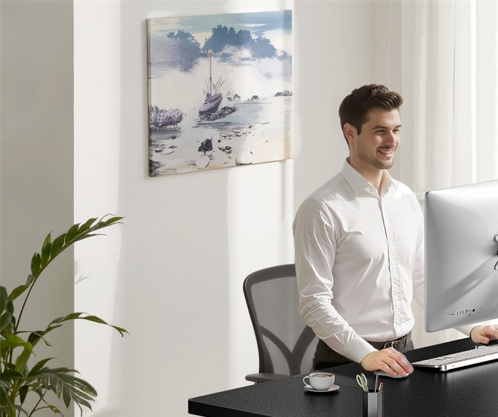 DeskShow electric standing desk in a bright home office